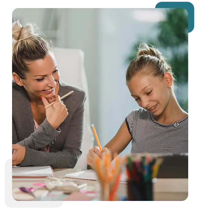 Teacher encouraging a student who is disengaged in class with supportive guidance and attention