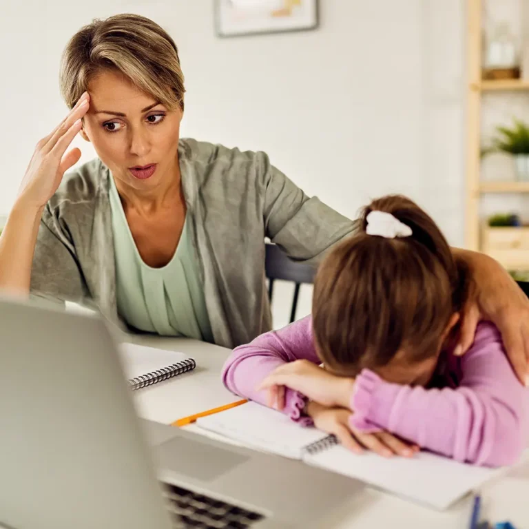 Teacher encouraging a student who is disengaged in class with supportive guidance and attention